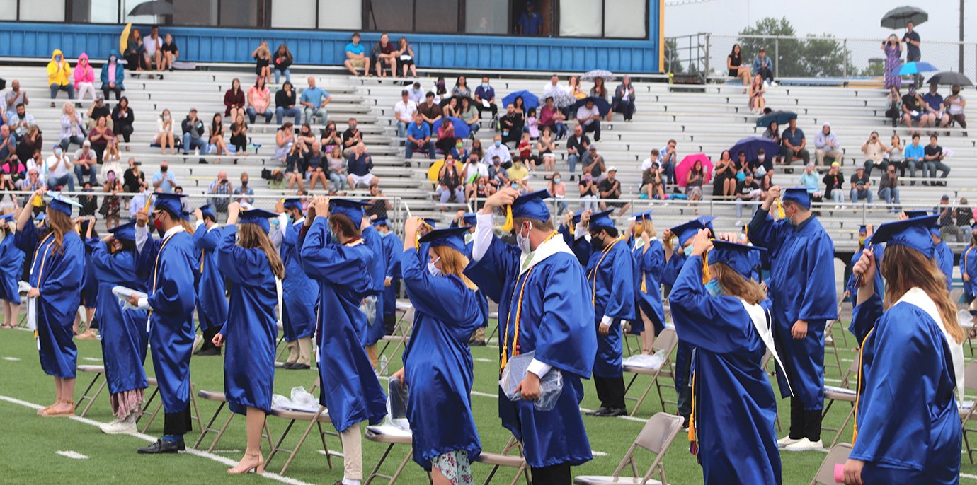 Now officially graduates of Crawfordsville High School, former students adjust their tassels.